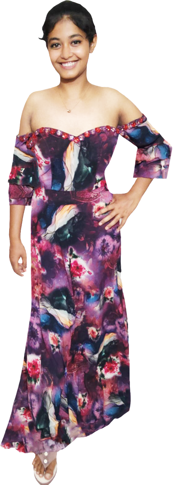 Young girl wearing a colorful off-shoulder dress on a white background