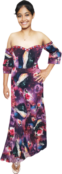 Young girl wearing a colorful off-shoulder dress on a white background