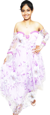 Woman wearing a strapless floral dress with purple accents on a white background