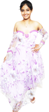 Woman wearing a strapless floral dress with purple accents on a white background