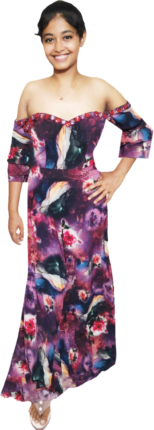 Young girl wearing a colorful off-shoulder dress on a white background