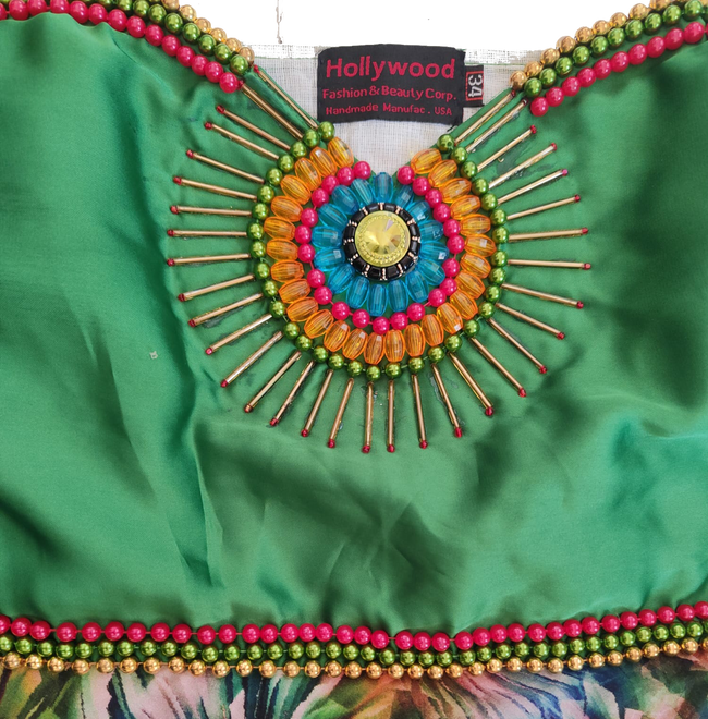Matching colorful traditional beaded handmade decorative Artful design outfit with a green top and multicolor skirt.