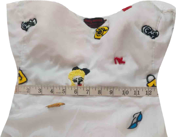 A Colorful Hand-Stitched Needle Work Beaded Design On White Back Ground